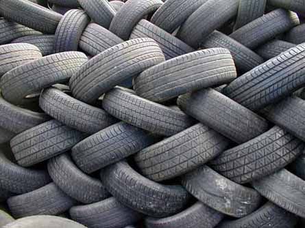 Old tires are piled up, ready for recycling